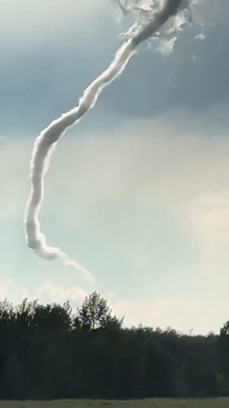 Canada Skies: A Rope-Like Funnel Spins Over an Open Field