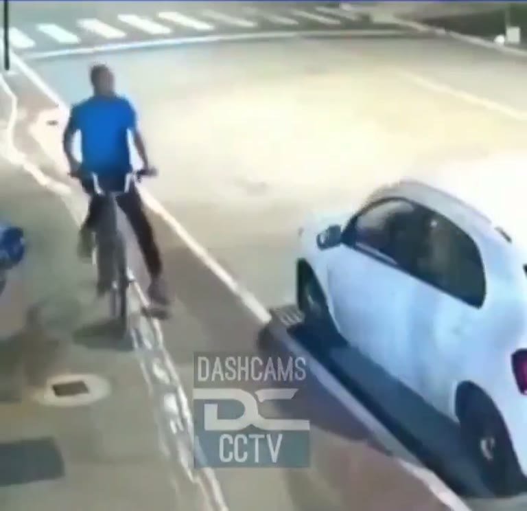 CCTV Shows Street Scuffle as Cyclist Reaches Waiting Car