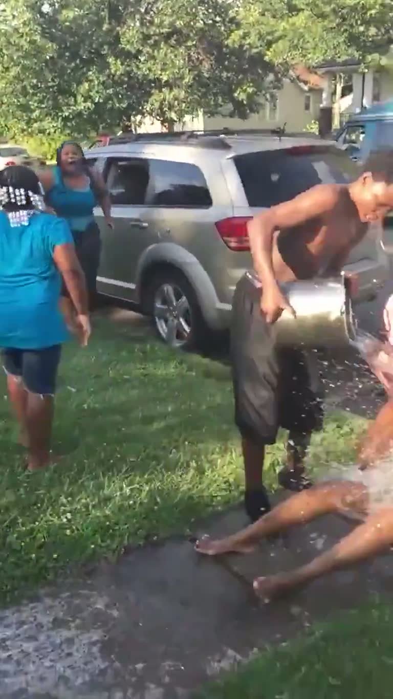 Viral Clip Shows Family's Water Bucket Punishment Over Bullying