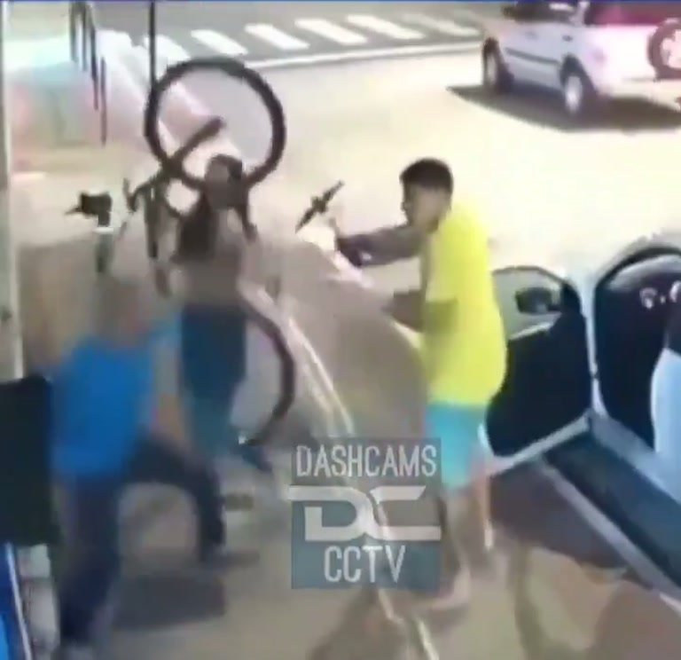 CCTV Shows Street Scuffle as Cyclist Reaches Waiting Car